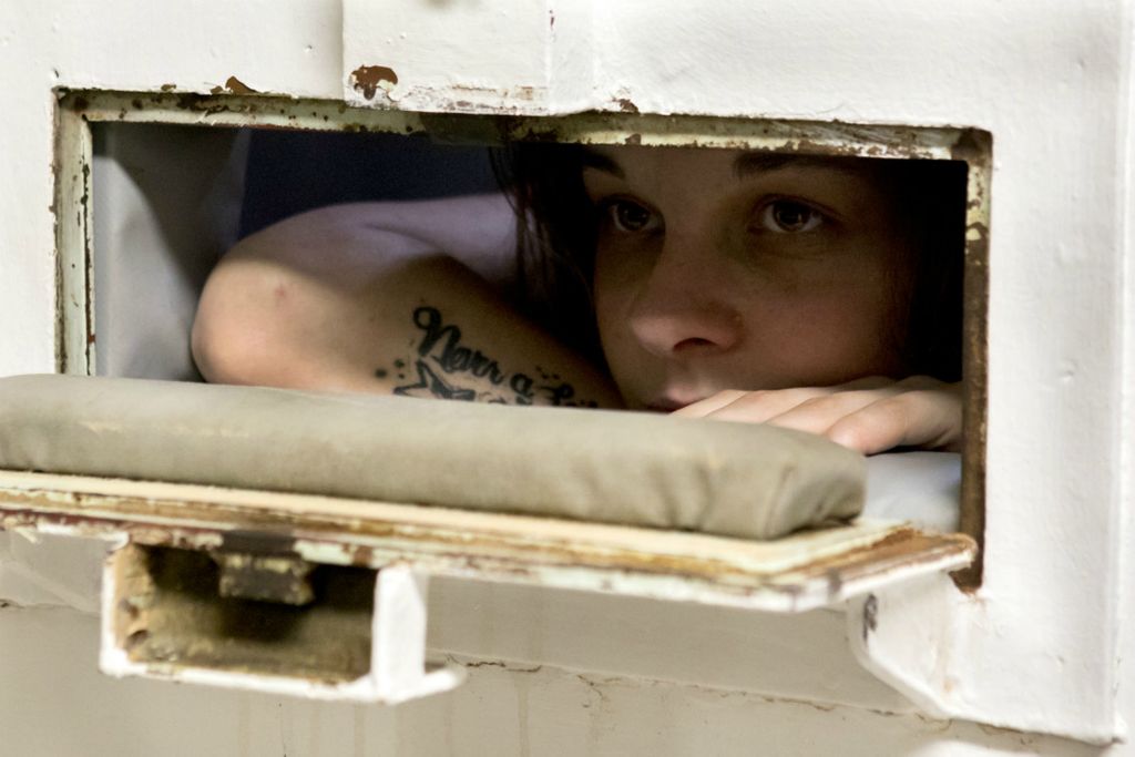 Best of Show - Jessica Phelps / Newark Advocate, “Life Locked Up in the County Jail”Kassie Carpenter, 23, looks out from the padded cell listening to the general population at the Coshocton County Justice Center in November, 2020. Carpenter was arrested for felony possession of drugs and shortly after placed on suicide  watch and placed in the padded cell. Carpenter was hoping to be able to turn her life around but had a hard time dealing with the recent death of her mother which drove her to be placed on suicide watch and later taken to a psychiatric hospital. 